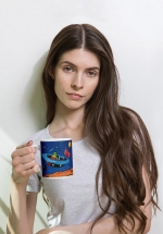 Woman holding a fun, unique, I Love Mars mug to proudly celebrate the greatest and most challenging endeavour humanity has ever embarked on. For the first humans to live and work on Mars
