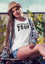 Woman wearing Zouk T-shirt decorated with unique “Life is better when I Zouk” design in white crew neck style