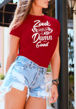 Woman wearing Zouk T-shirt decorated with unique “Zouk feels so damn good” design (red crew neck style)